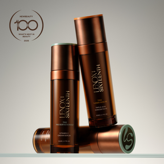 Serum bottles standing and laying on glass surface